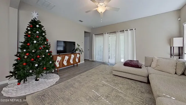 a living room with furniture potted plant and a fireplace