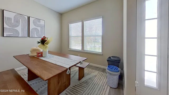 a room that has a table and a chair in it