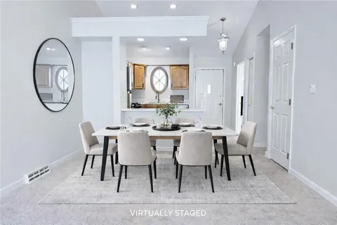 a view of a dining room with furniture