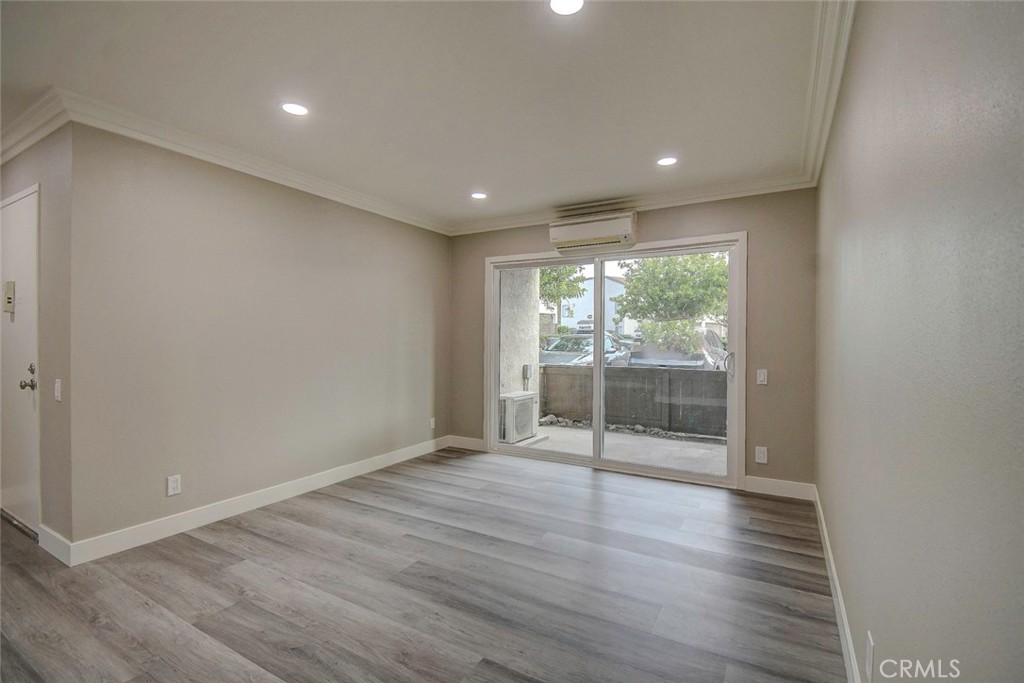 21941 Rimhurst Drive, Unit D Lake Forest, CA 92630 - Photo 16 of 44 a view of empty room with wooden floor