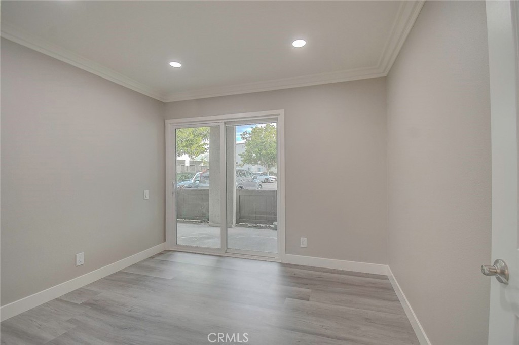 21941 Rimhurst Drive, Unit D Lake Forest, CA 92630 - Photo 24 of 44 wooden floor in an empty room with a window