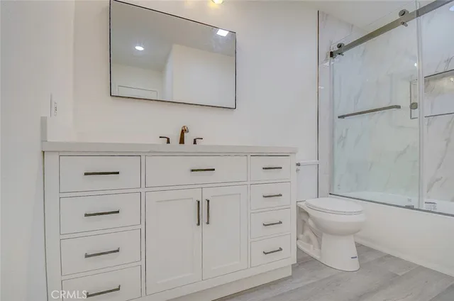 a bathroom with a shower and a toilet