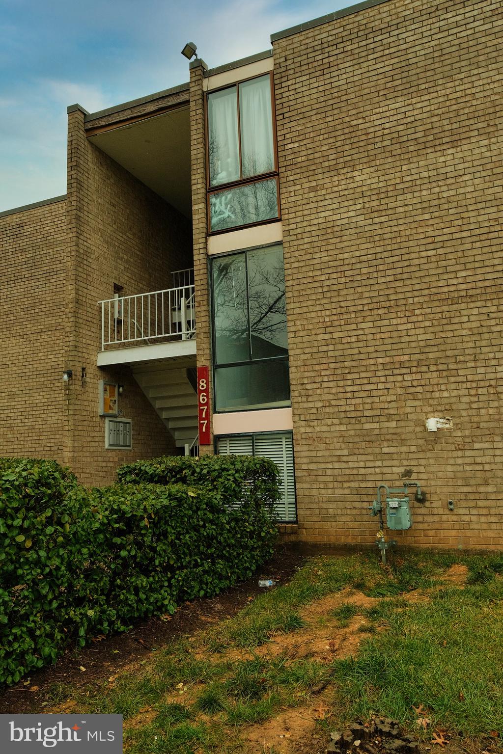 8677 Greenbelt Road, Unit 101 Greenbelt, MD 20770 - Photo 10 of 10 a view of house with a yard