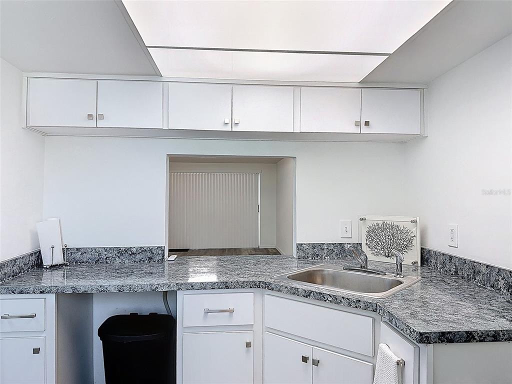 4224 Terrapin Place, Unit 4224 New Port Richey, FL 34652 - Photo 12 of 58 a kitchen with a sink and cabinets