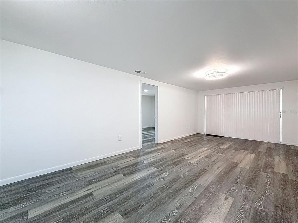 4224 Terrapin Place, Unit 4224 New Port Richey, FL 34652 - Photo 19 of 58 a view of empty room with wooden floor