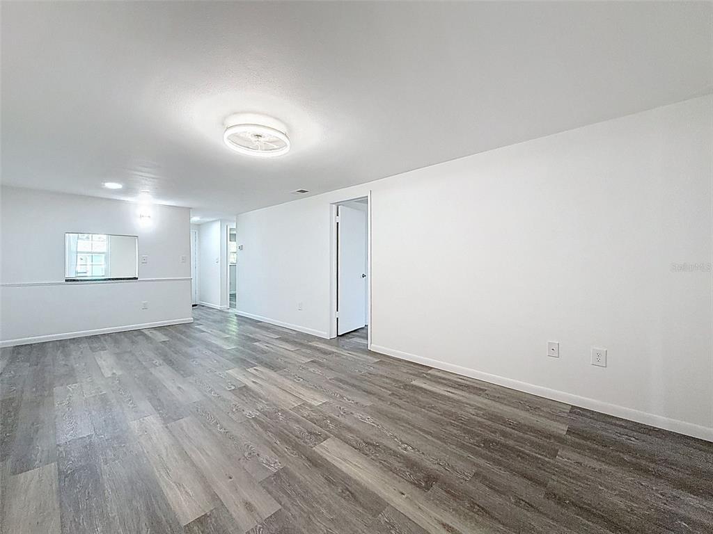 4224 Terrapin Place, Unit 4224 New Port Richey, FL 34652 - Photo 21 of 58 a view of an empty room and wooden floor