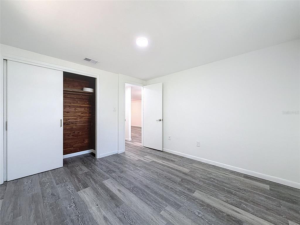 4224 Terrapin Place, Unit 4224 New Port Richey, FL 34652 - Photo 24 of 58 a view of an empty room with wooden floor