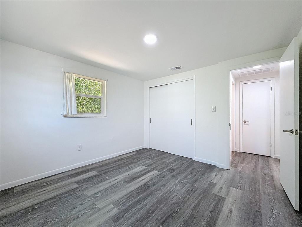 4224 Terrapin Place, Unit 4224 New Port Richey, FL 34652 - Photo 26 of 58 a view of room with wooden floor and window