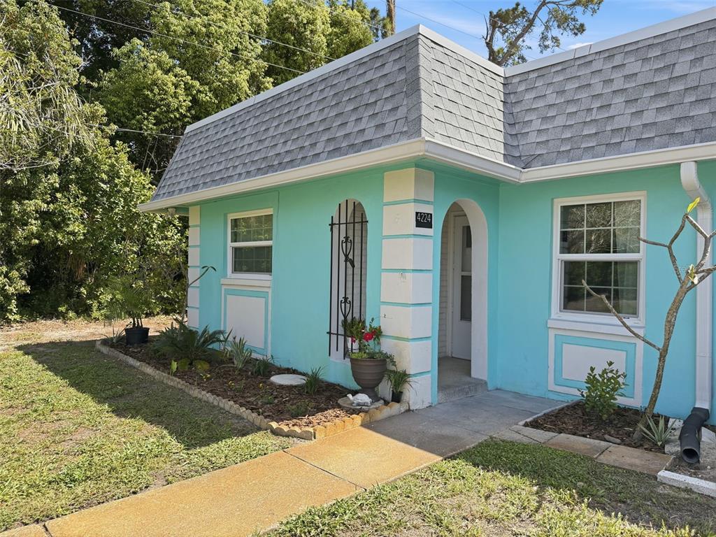4224 Terrapin Place, Unit 4224 New Port Richey, FL 34652 - Photo 3 of 58 a front view of a house with garden