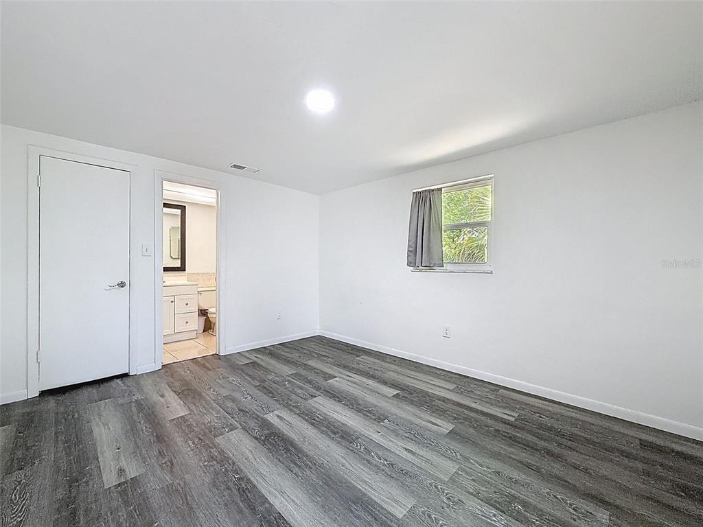 4224 Terrapin Place, Unit 4224 New Port Richey, FL 34652 - Photo 34 of 58 a view of empty room with wooden floor and fan