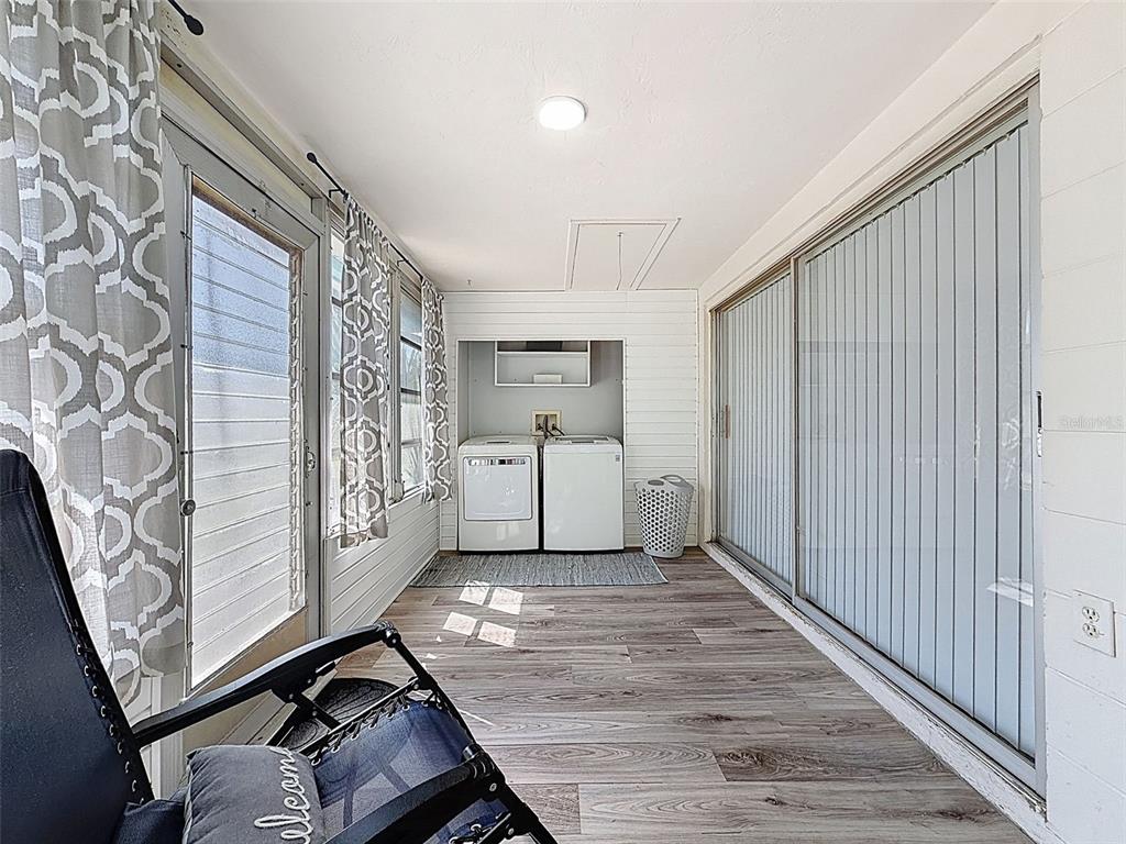 4224 Terrapin Place, Unit 4224 New Port Richey, FL 34652 - Photo 39 of 58 a view of a room with wooden floor and white walls