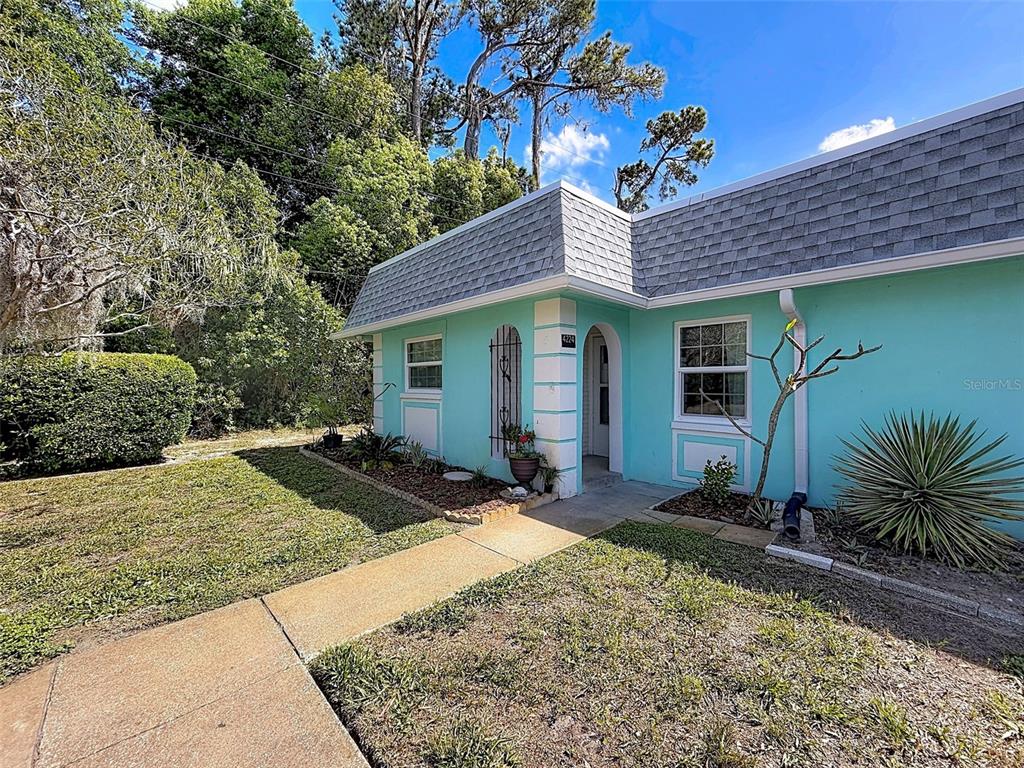 4224 Terrapin Place, Unit 4224 New Port Richey, FL 34652 - Photo 4 of 58 a front view of a house with garden