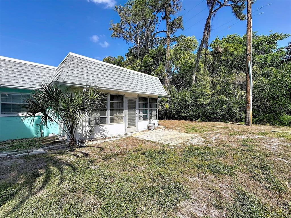 4224 Terrapin Place, Unit 4224 New Port Richey, FL 34652 - Photo 42 of 58 a front view of a house with garden