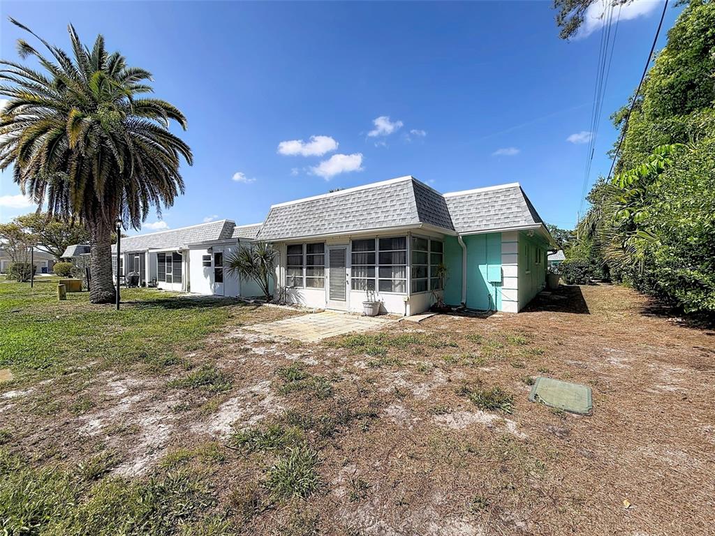 4224 Terrapin Place, Unit 4224 New Port Richey, FL 34652 - Photo 44 of 58 a front view of a house with a garden