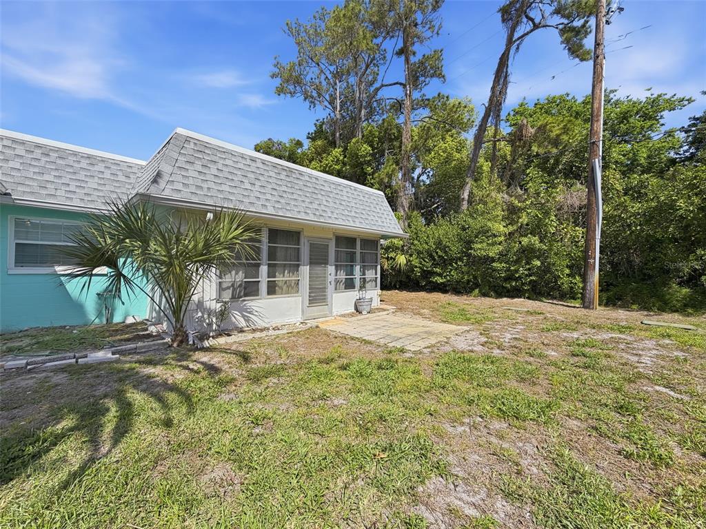 4224 Terrapin Place, Unit 4224 New Port Richey, FL 34652 - Photo 46 of 58 a view of a house with a yard and potted plants