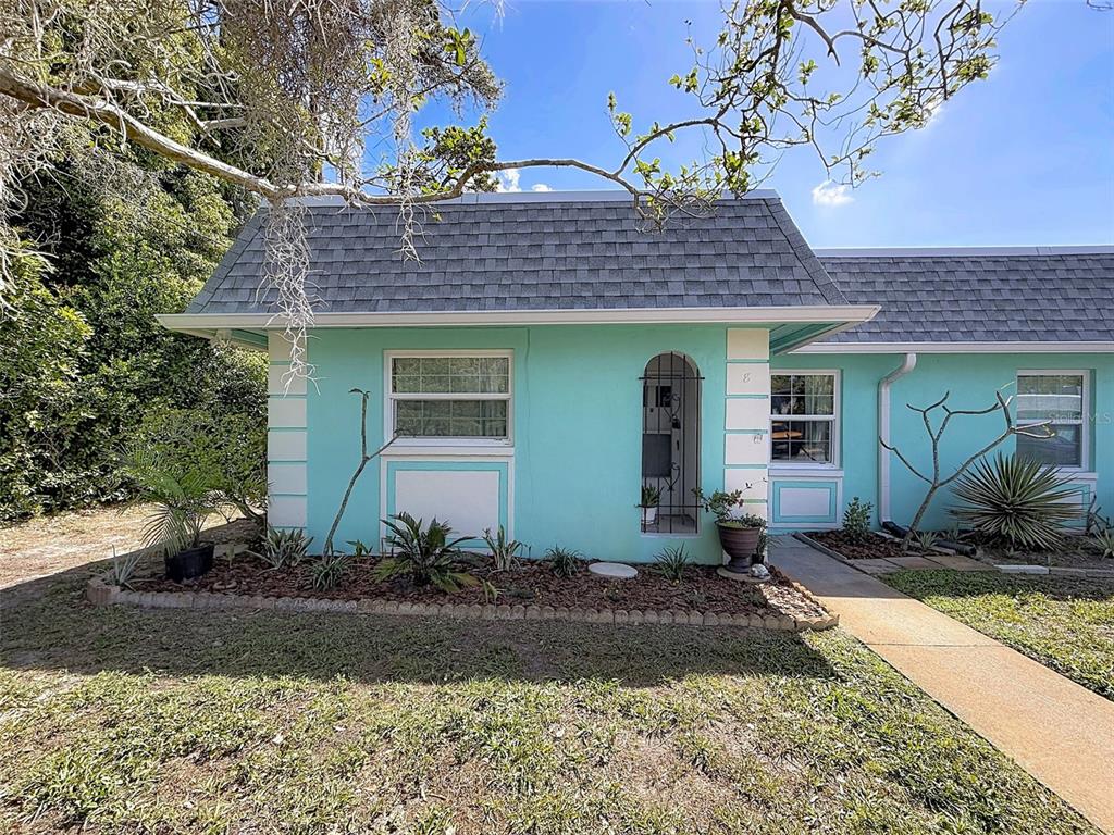 4224 Terrapin Place, Unit 4224 New Port Richey, FL 34652 - Photo 5 of 58 a front view of a house with a yard
