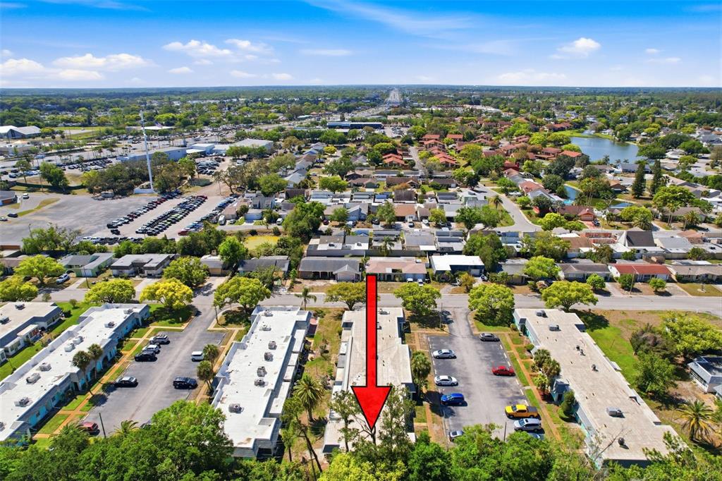 4224 Terrapin Place, Unit 4224 New Port Richey, FL 34652 - Photo 53 of 58 an aerial view of residential houses with outdoor space and trees