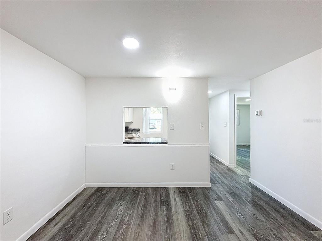 4224 Terrapin Place, Unit 4224 New Port Richey, FL 34652 - Photo 8 of 58 a view of empty room with wooden floor