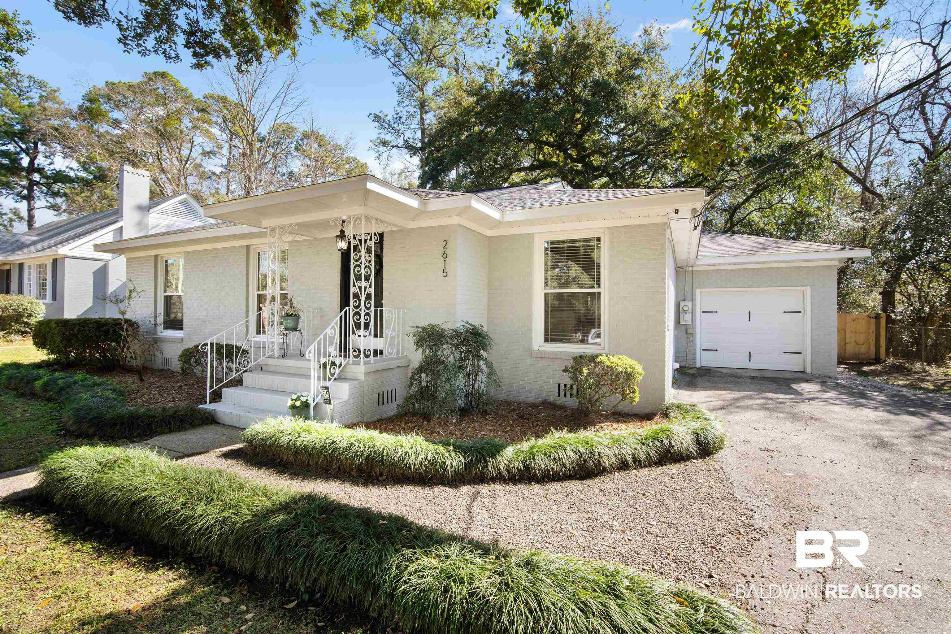 2615 Walton Avenue Mobile, AL 36606 - Photo 5 of 33 Single story home featuring a garage, fence, aphalt driveway, and brick siding