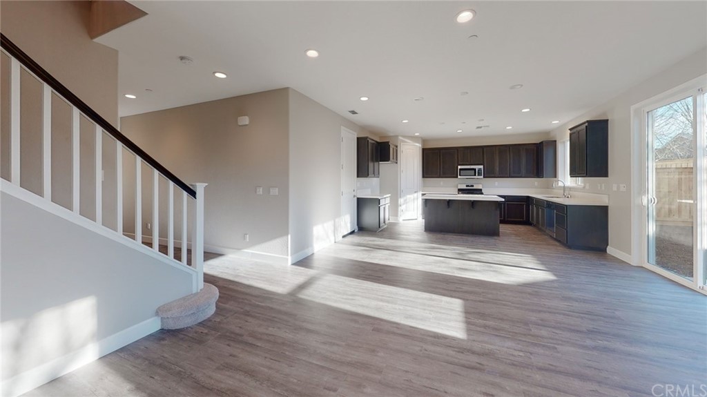 63 Bentwater Loop Chico, CA 95973 - Photo 12 of 20 a view of kitchen with cabinets and wooden floor