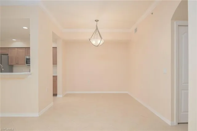 a view of a room with wooden floor and white walls