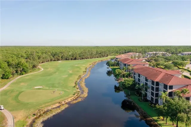 an aerial view of a house with a lake view