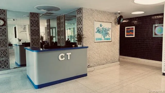 a view of kitchen with stainless steel appliances granite countertop a refrigerator and a stove top oven