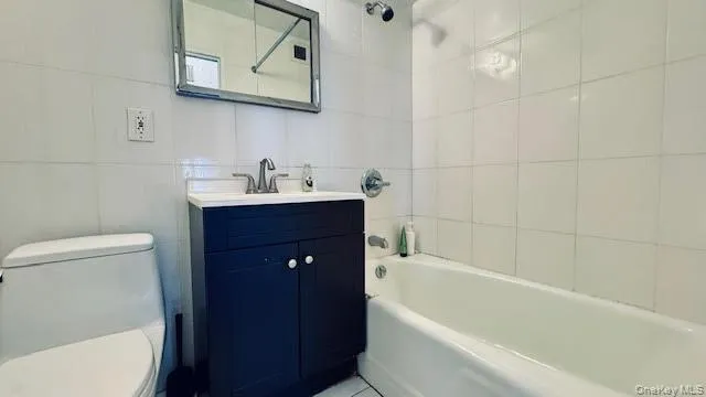 a bathroom with a sink a toilet and bathtub