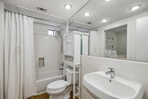a view of a balcony with toilet and sink