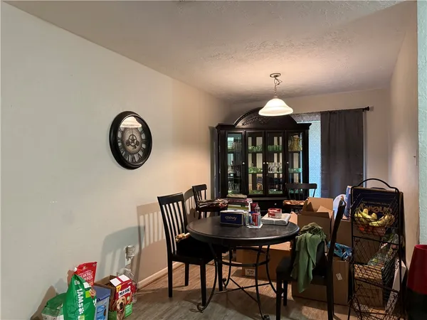 a view of a dining room with furniture and chandelier