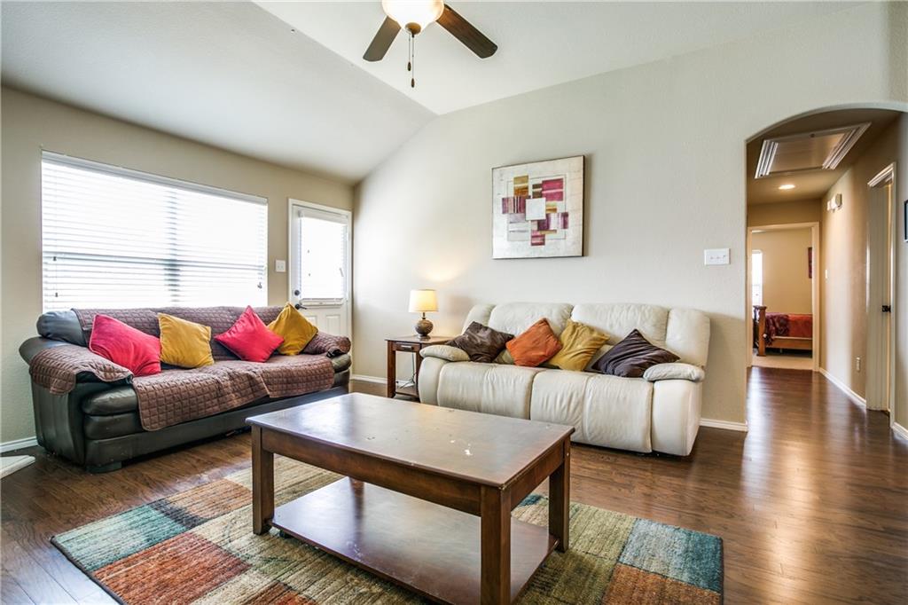 713 Setting Sun Trail McKinney, TX 75069 - Photo 15 of 25 a living room with furniture and a large window