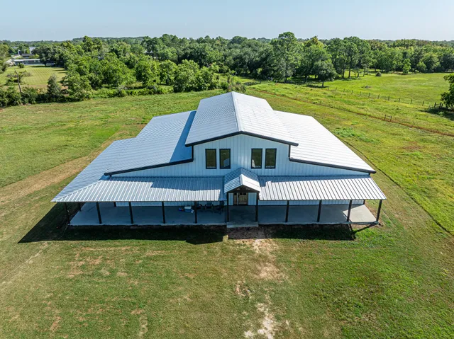 a view of a big yard with an outdoor space