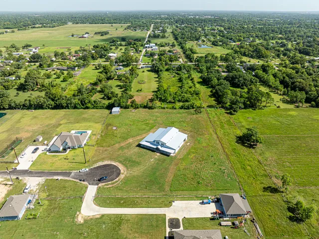 a view of empty room with fireplace and stairs