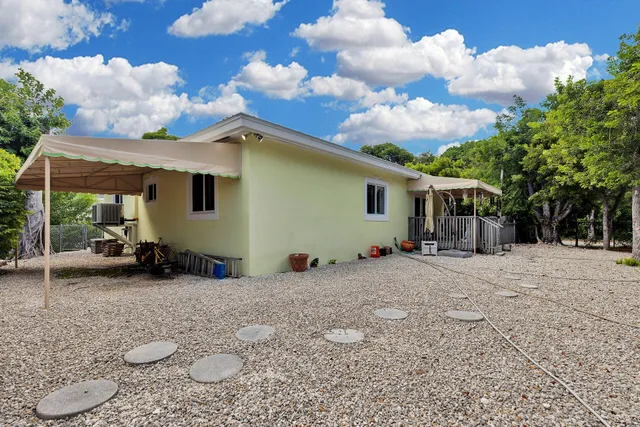 a view of a backyard with a sitting area