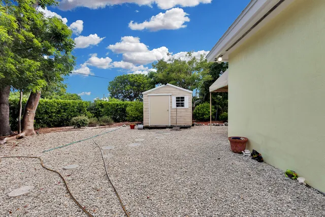 a house with trees in the background