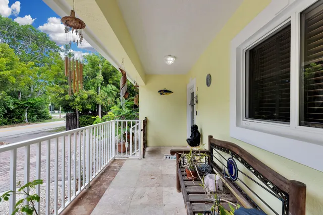 a view of a balcony with chairs