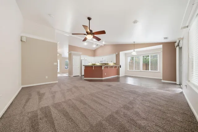 a view of backyard of house and garage