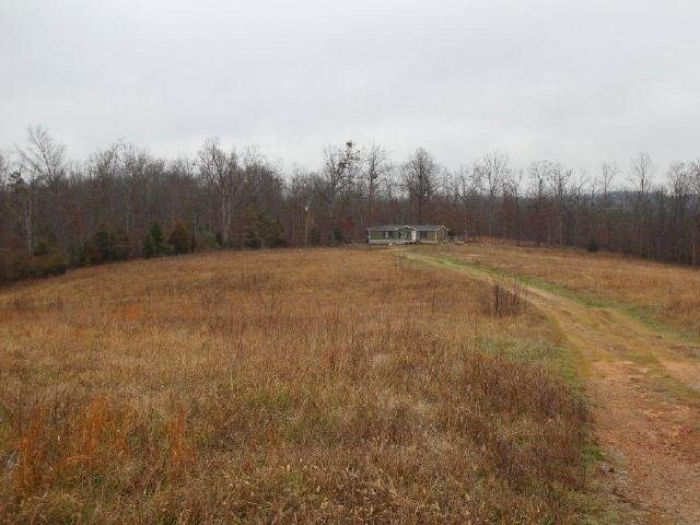 1642 Duffell Martin Road Comer, GA 30629 - Photo 1 of 1 a view of dirt field and trees in the background