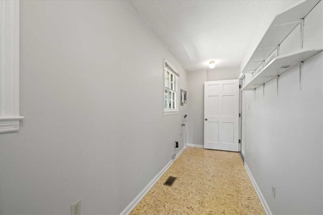 304 Shaw Road Honea Path, SC 29654 - Photo 28 of 39 This spacious laundry room offers convenience and ample storage for daily tasks.