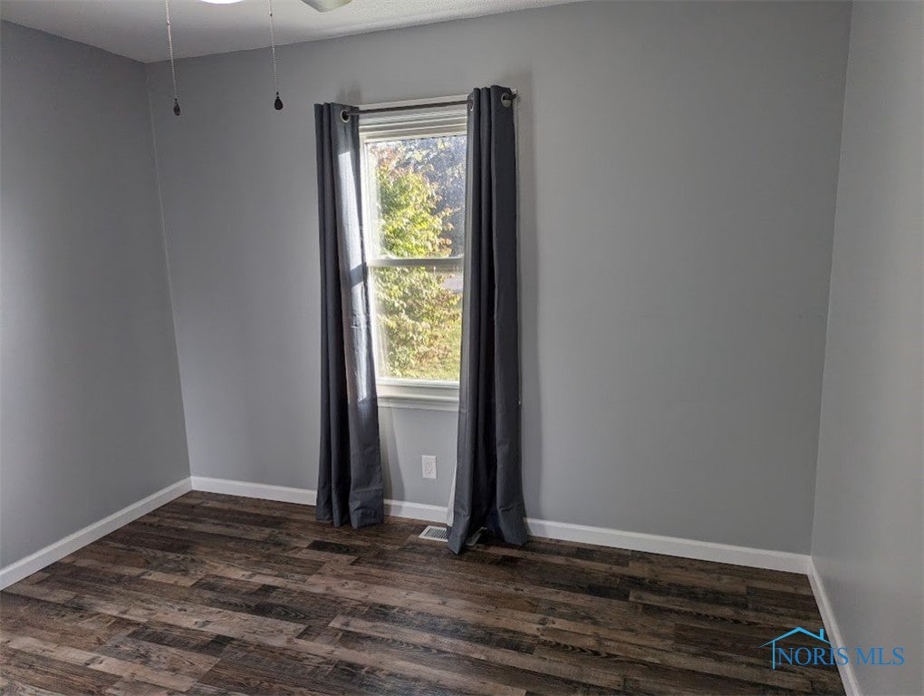 308 Indian Road Wauseon, OH 43567 - Photo 36 of 48 Bedroom #2 with new light fixtures and vinyl plank floor covering.
