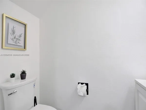 a view of hallway with a small white wall