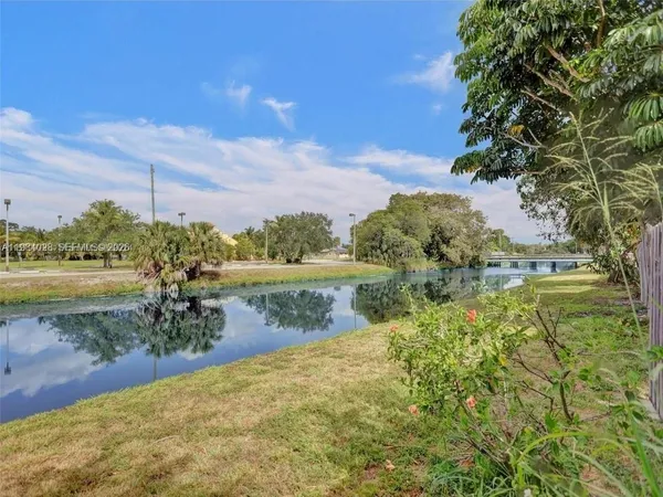 a view of a lake with a yard