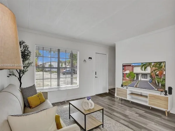 a living room with furniture and window