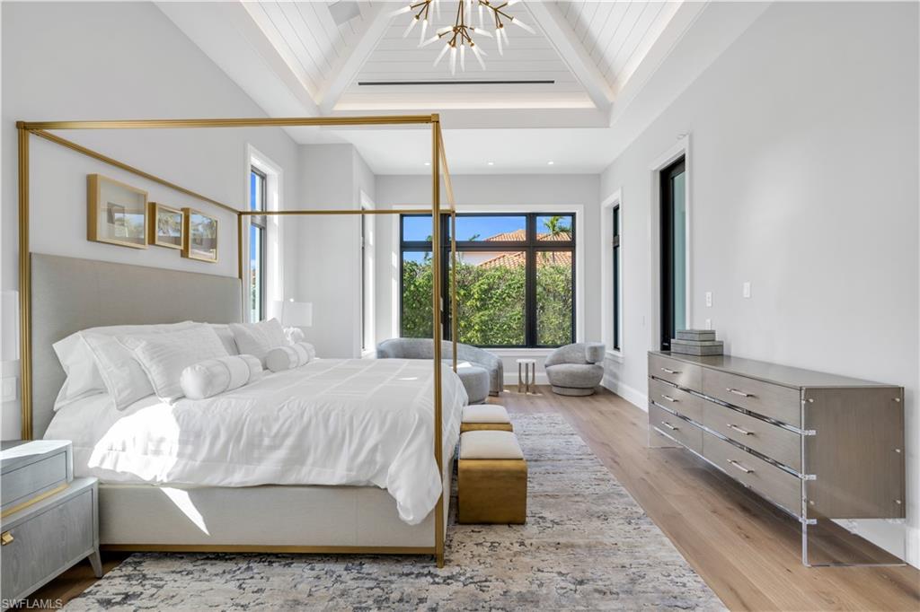 635 Harbour Drive Naples, FL 34103 - Photo 12 of 32 a living room with furniture and large windows