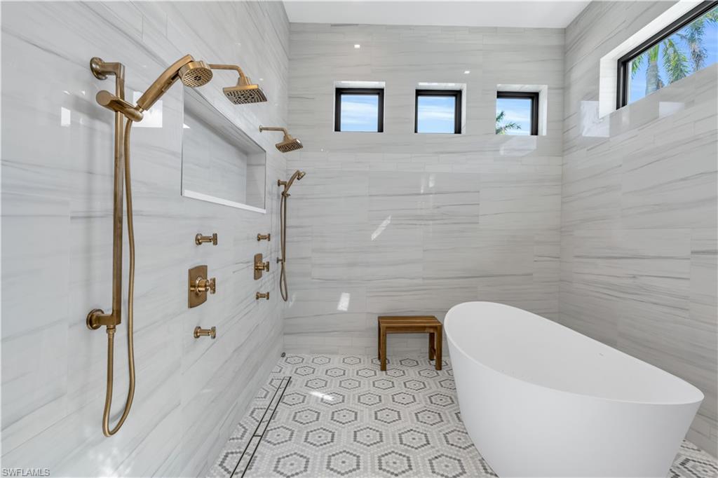 635 Harbour Drive Naples, FL 34103 - Photo 15 of 32 a bathroom with a toilet and a shower