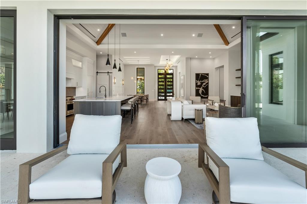 635 Harbour Drive Naples, FL 34103 - Photo 19 of 32 a living room with furniture and a wooden floor