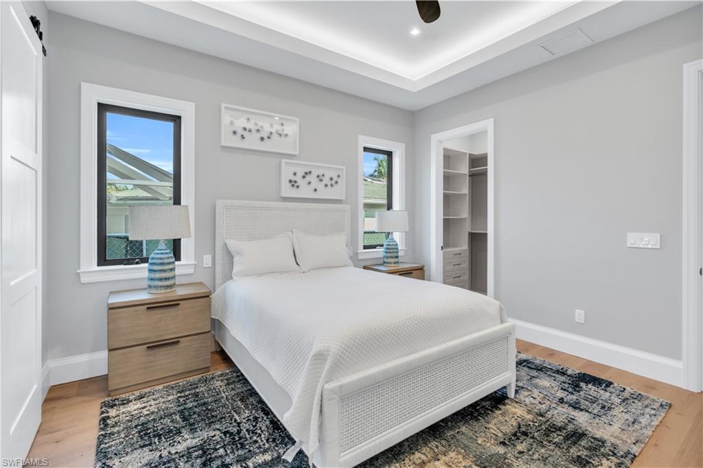 635 Harbour Drive Naples, FL 34103 - Photo 29 of 32 a bedroom with a bed and a window