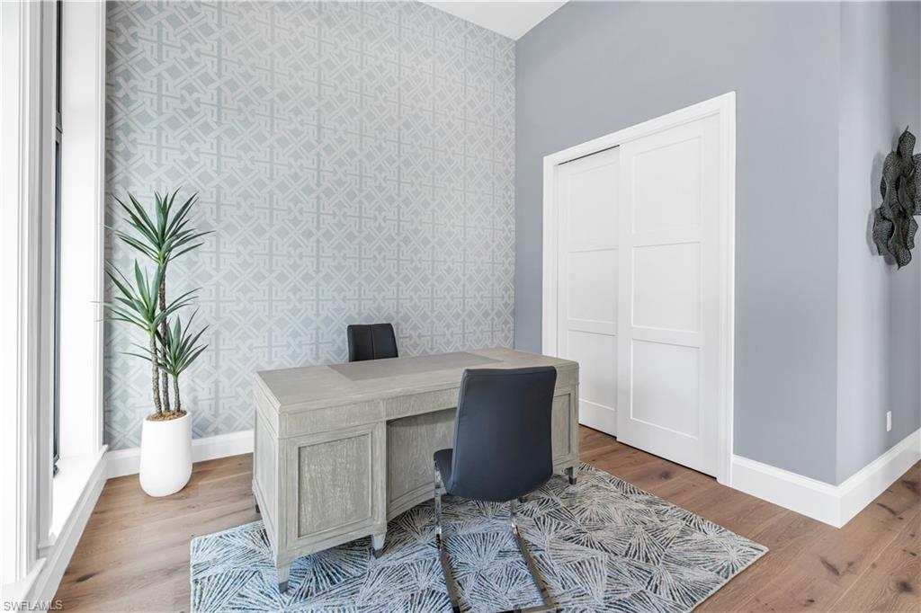 635 Harbour Drive Naples, FL 34103 - Photo 31 of 32 a workspace with furniture and wooden floor