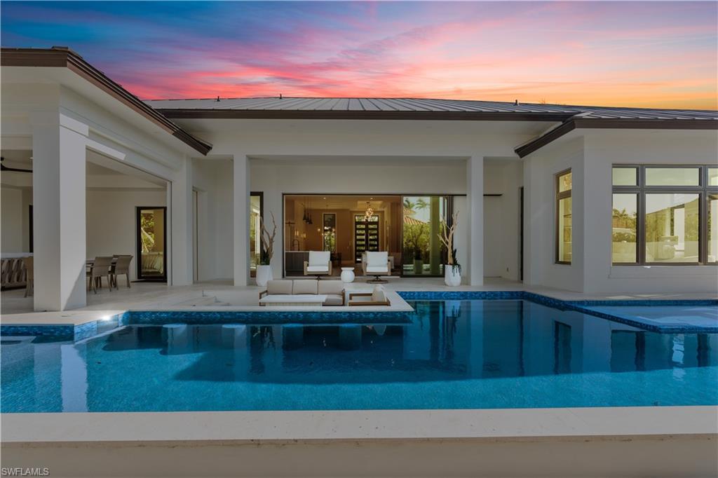 635 Harbour Drive Naples, FL 34103 - Photo 32 of 32 a living room with kitchen furniture and a potted plant