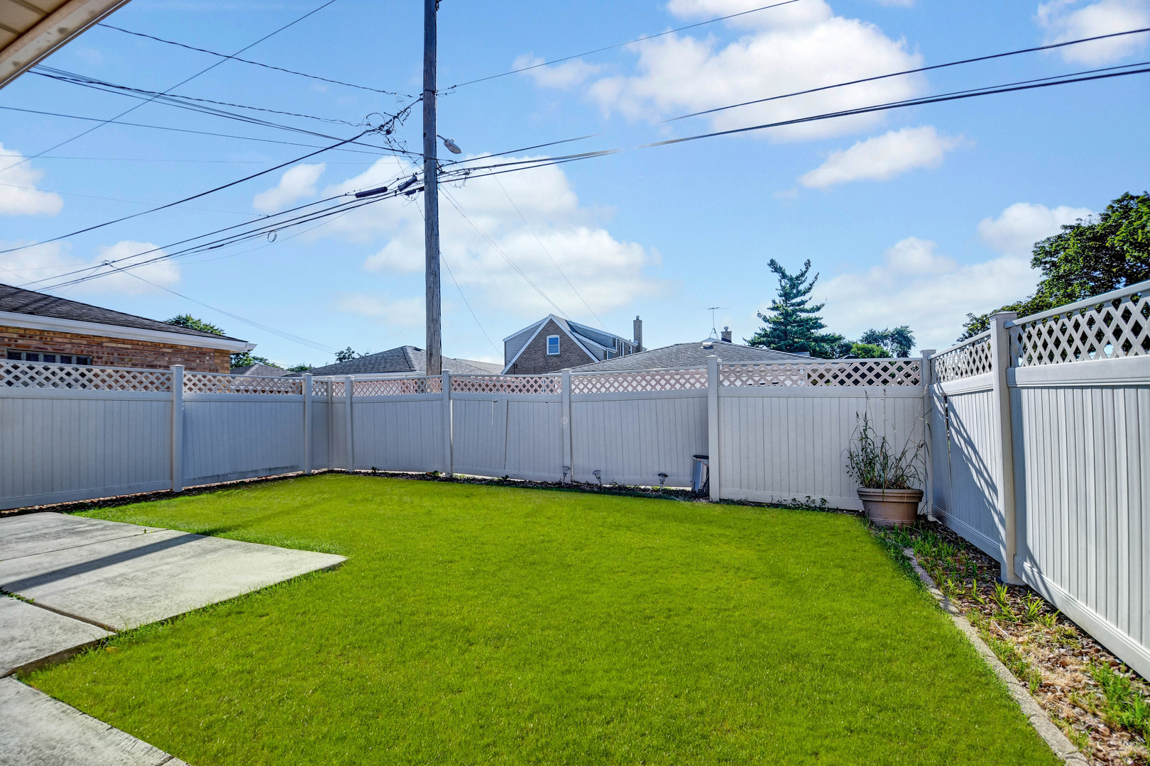 5700 South Monitor Avenue Chicago, IL 60638 - Photo 22 of 22 a view of a backyard with wooden fence